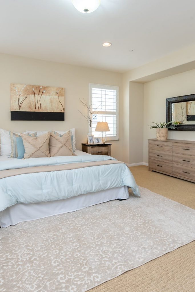 Bright modern bedroom with neutral decor and cozy ambiance, perfect for home decor inspiration.