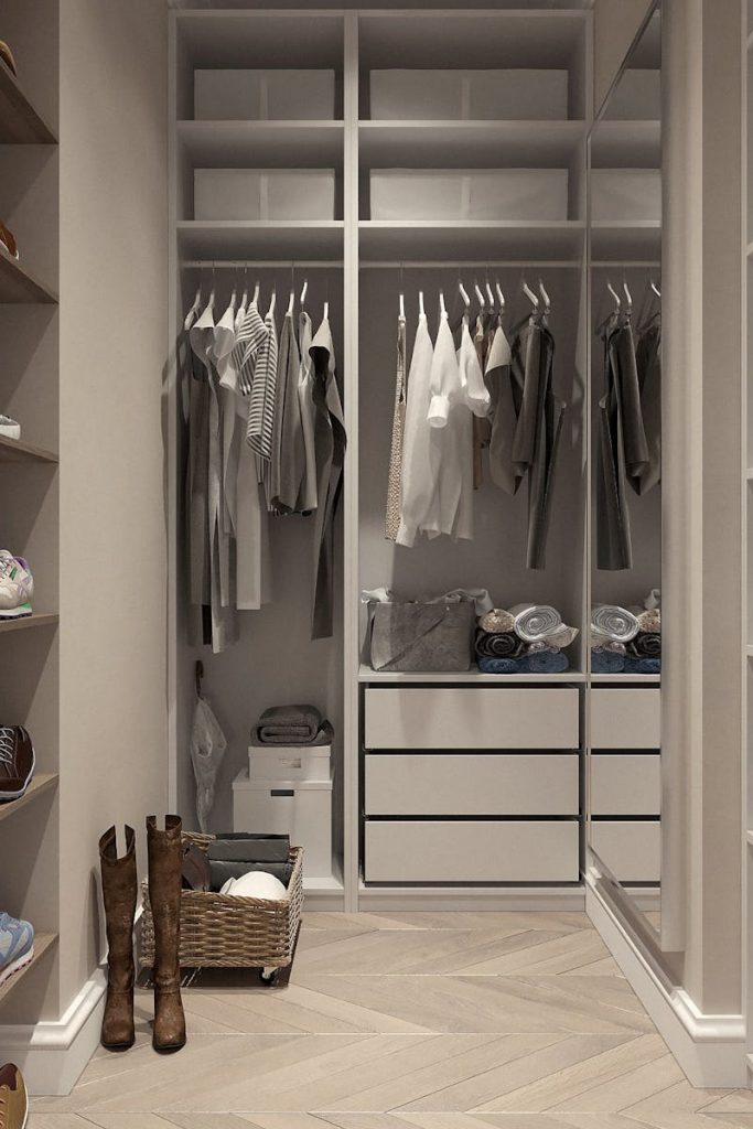 Stylish walk-in closet with neutral tones and contemporary design elements.
